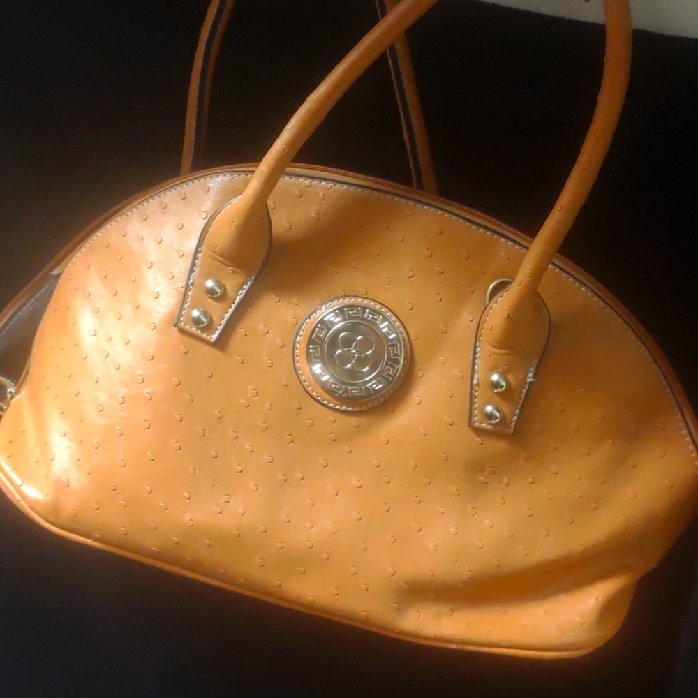 Camel color purse...new..tired of sitting around